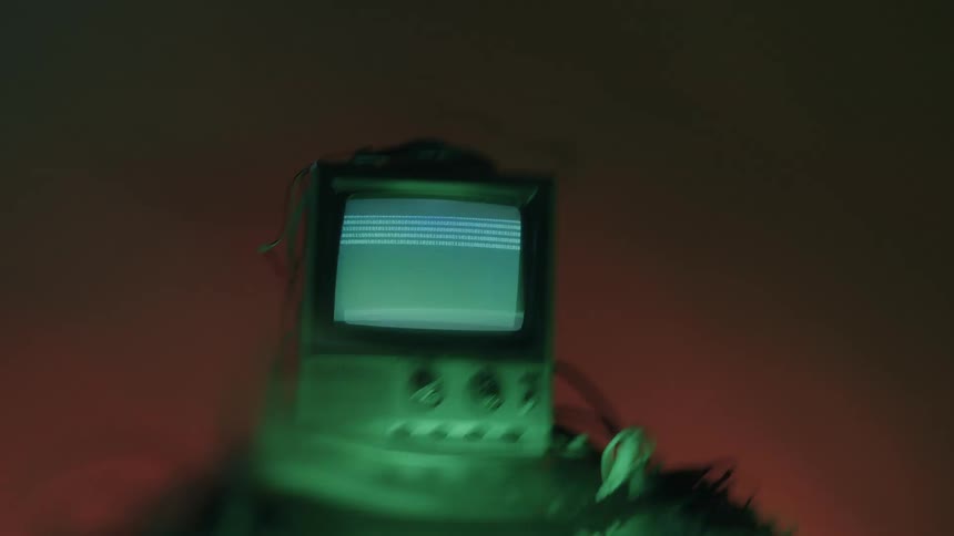 The television displays lines at the top of the screen