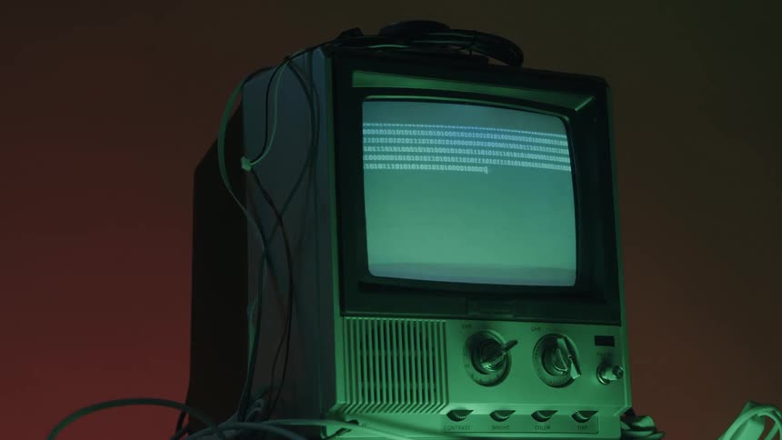 Close up of a connected electronic display device showing multiple binary digits on its screen