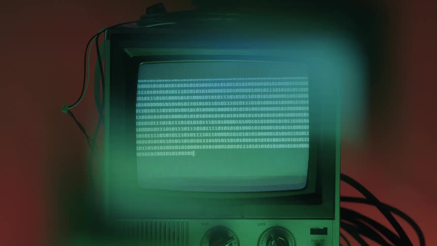 Zeros and ones flash on the television screen