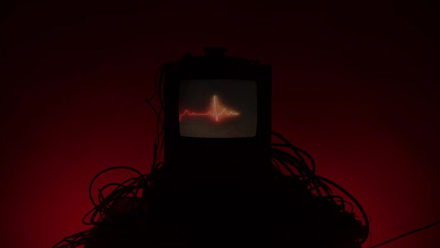 A heart line flashes on the television