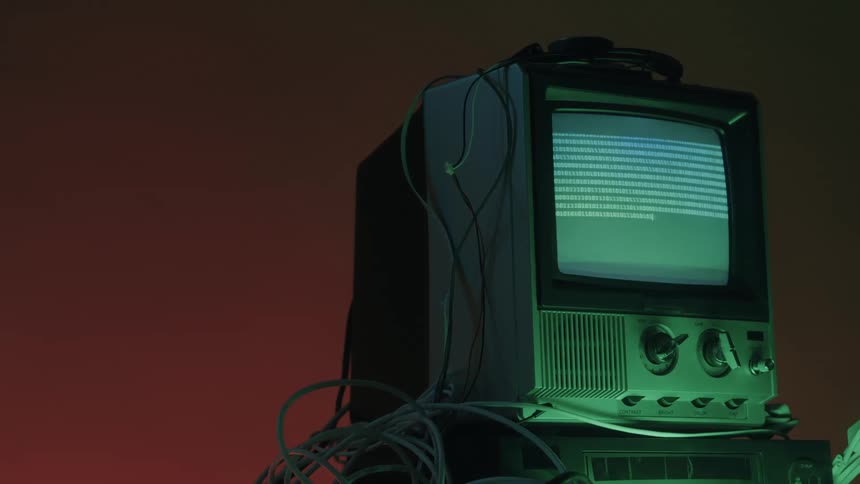 Close up of a connected electronic display device showing multiple binary digits on its screen