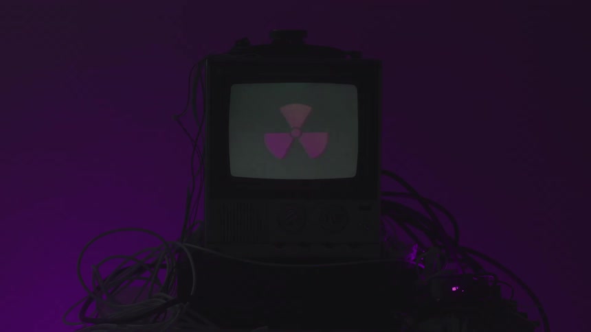 The symbols flash on the tv in the dark room