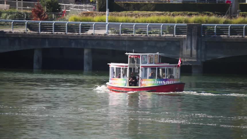 The ferry travels close to the shore of the city