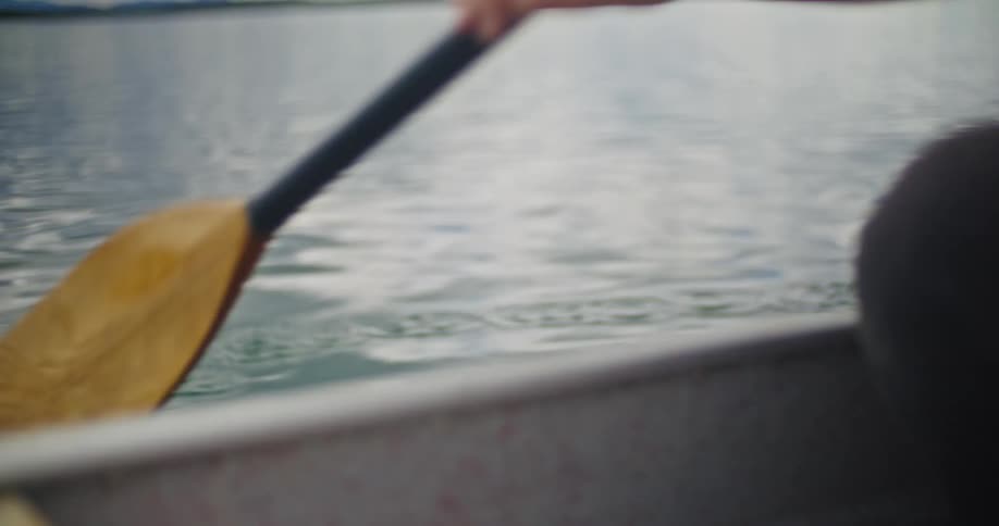 The person paddles the boat
