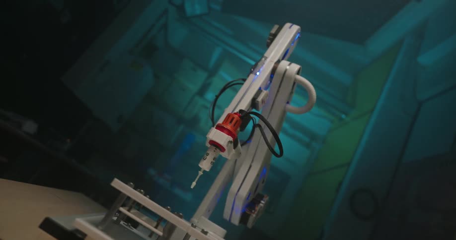 A sophisticated white robotic arm with a syringe tip moves precisely in a futuristic blue lit laboratory