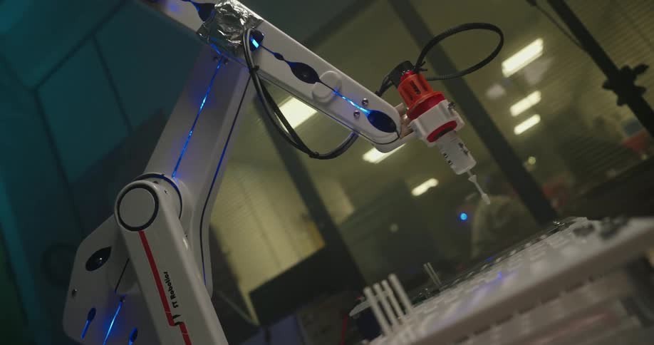 Close up of a robotic arm in operation in a lab