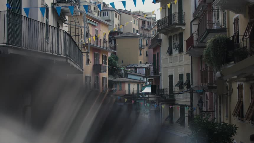 People walk in the alley by the apartments