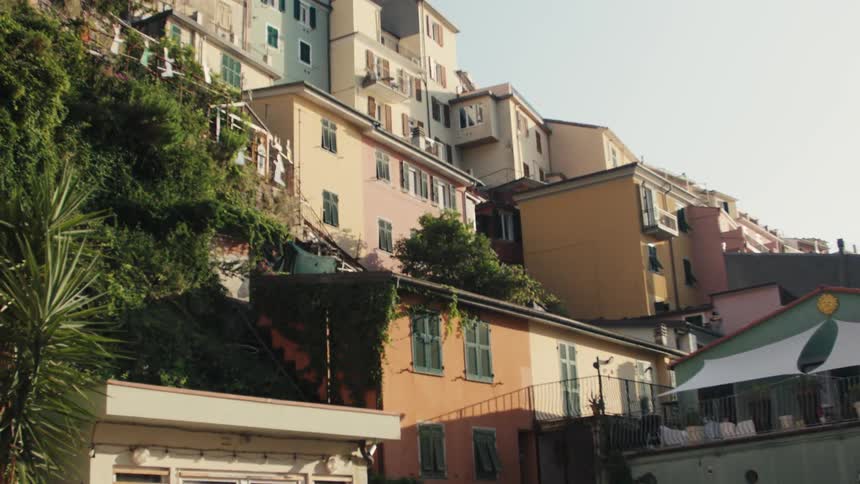 Colorful houses built on a hillside under a clear sky