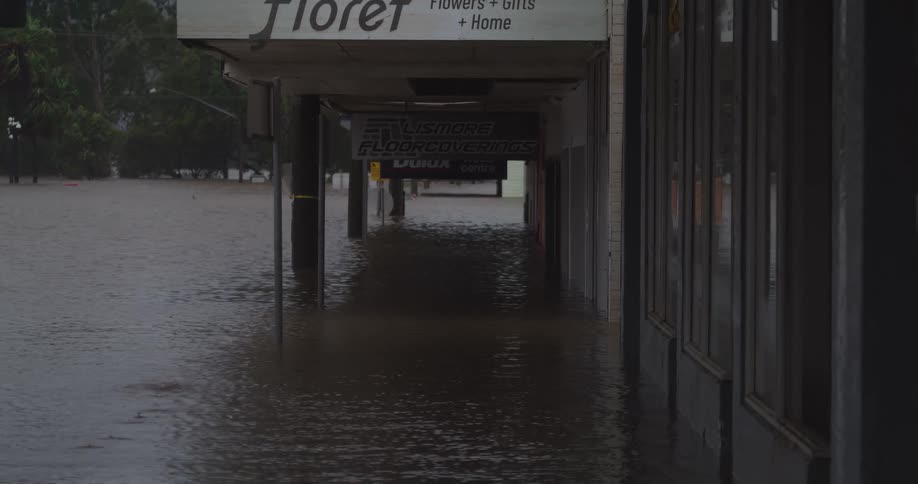 The road in town is completely flooded as it rains