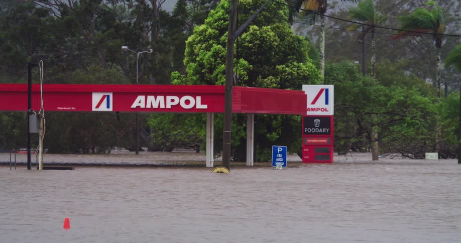 Flooded gas station with water reaching nearly the entire structure