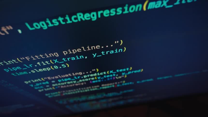 The computer code is scrolling on the screen