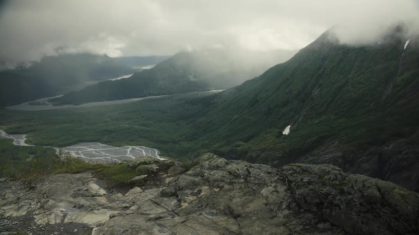 Mountain range under intense fog outdoors