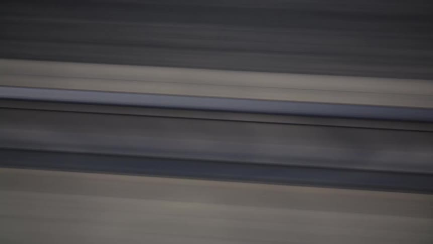 The video shows a closeup abstract pattern of dark and light horizontal stripes that quickly and smoothly rotate diagonally a watermark reading filmsupply is visible across the center of the frame