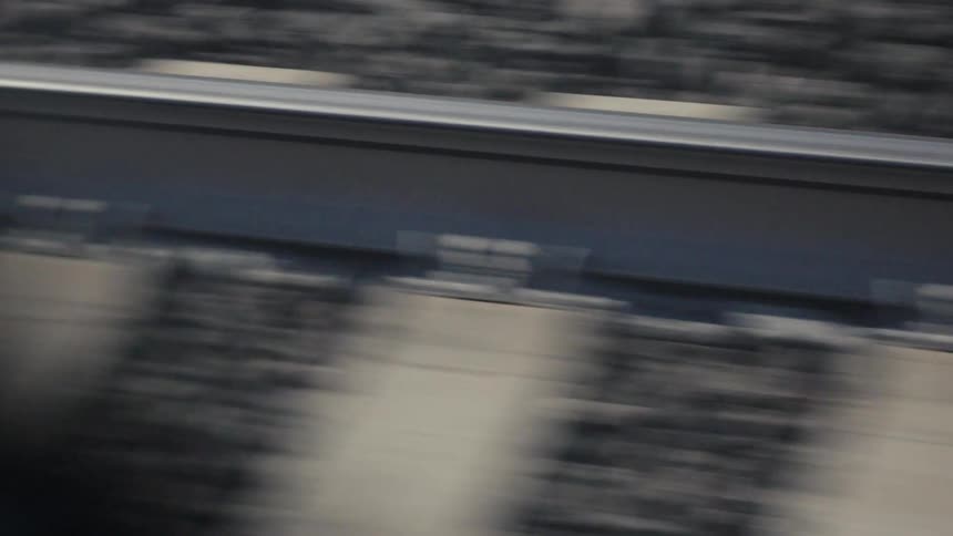 Train track with motion blur over sleepers and gravel ballast