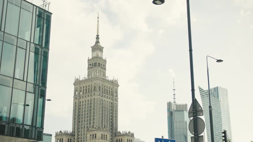 City skyline of a clock tower in a metropolitan area during daytime