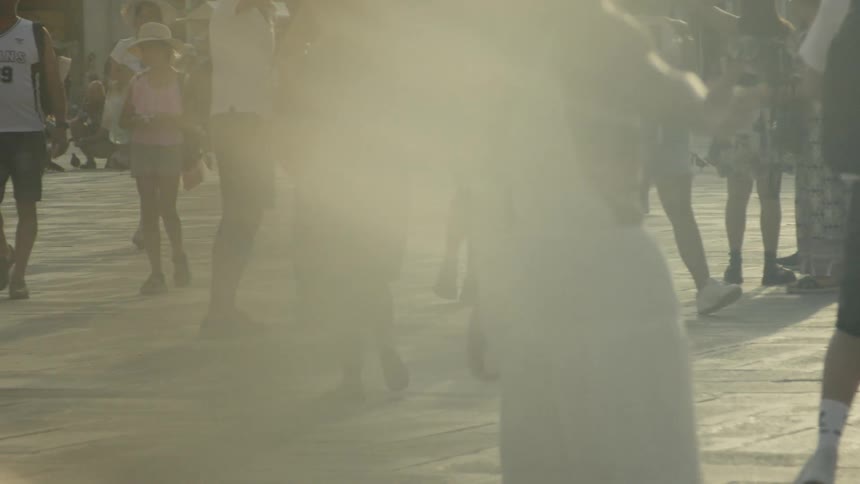 The bright sun shines on the crowd