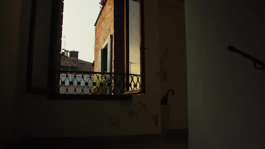 A house with sunlight reflecting off the front porch