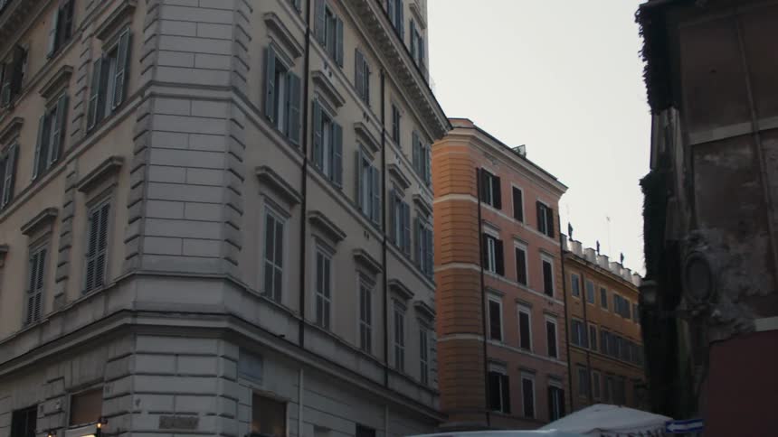Facades of old buildings with aligned windows on an urban street