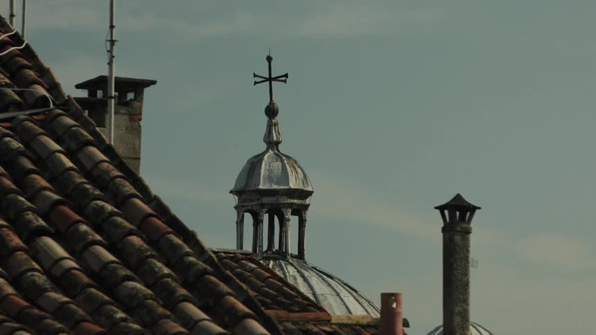 Building dome with a lantern in a city during daytime
