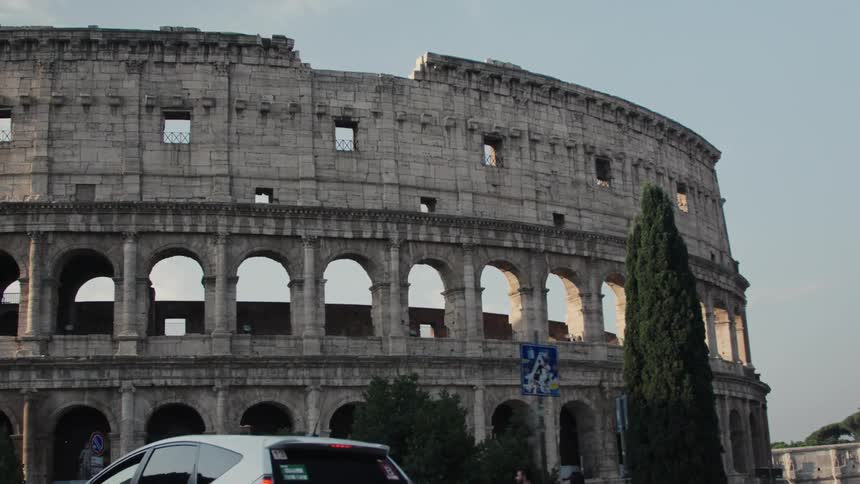 People are walking towards the coliseum