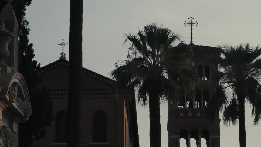 Religious christian buildings and architecture in a city at sunset