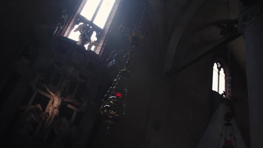 Sculptures and decorations at a religious altar in a church during daytime