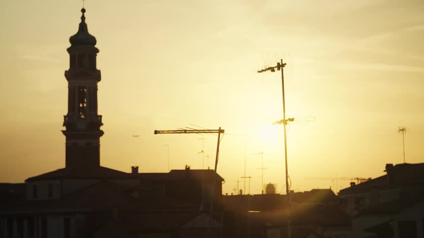 The sun is rising on the city