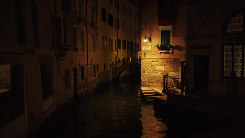 The water runs through the canal by the apartments