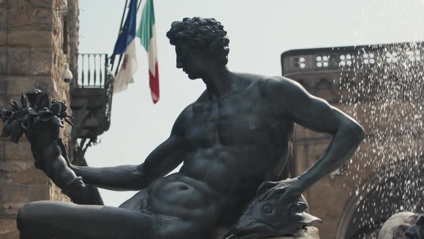 Male sculpture holding flowers