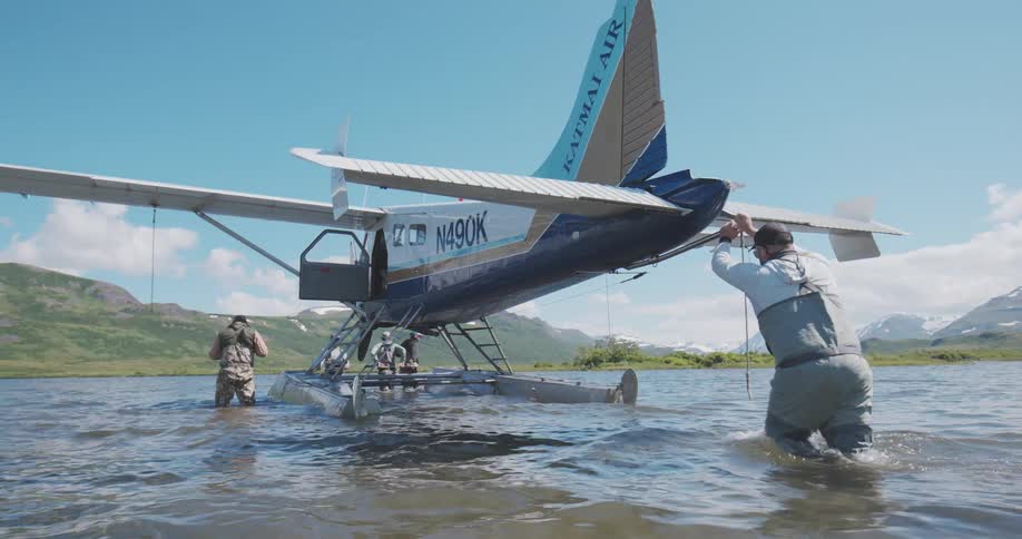 The boat is being pushed across the lake