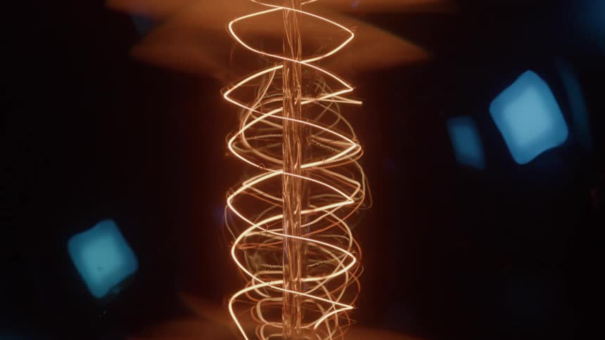 The wire in the old lightbulb shines