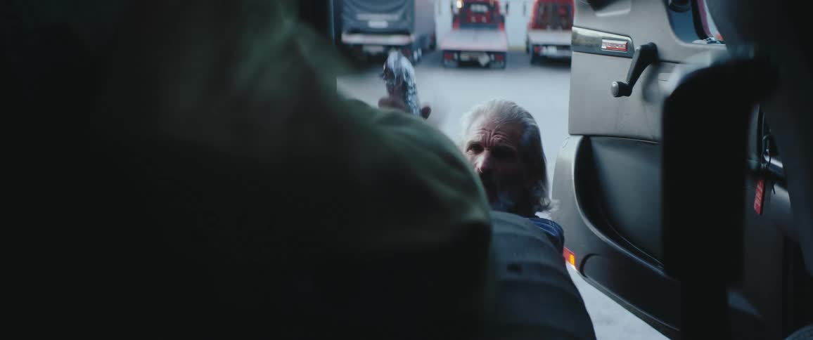 Man opens truck door and places his backpack on the seat