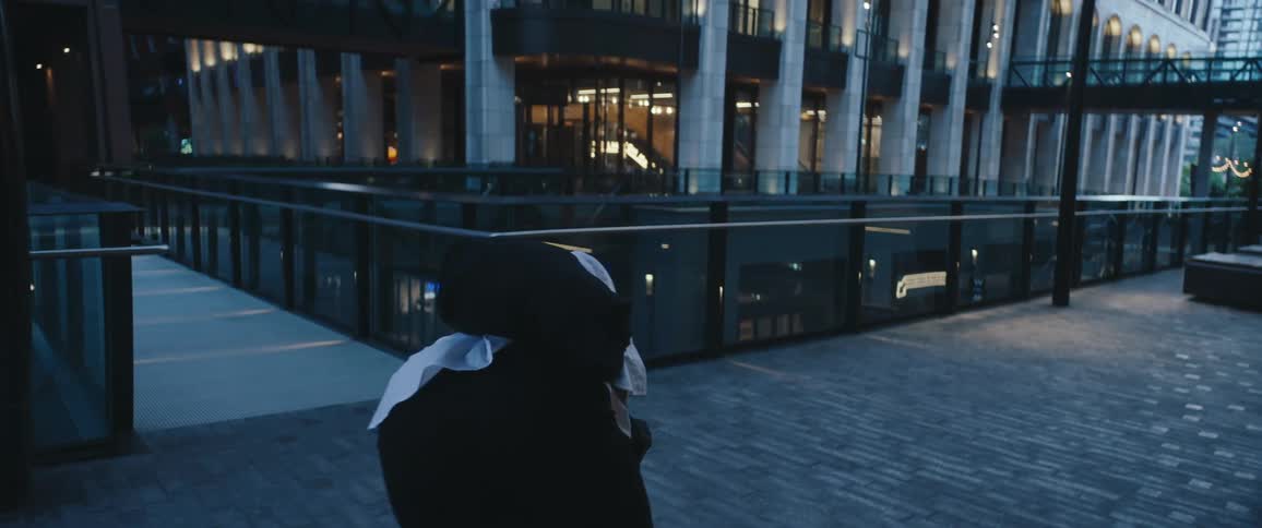 Woman walking outdoors takes off her shoes