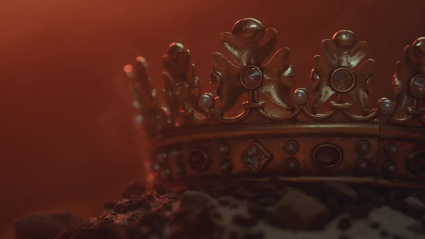 The gold crown is on a pillow