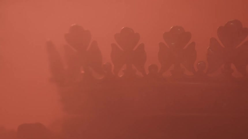 Decorative crown surrounded by orange haze