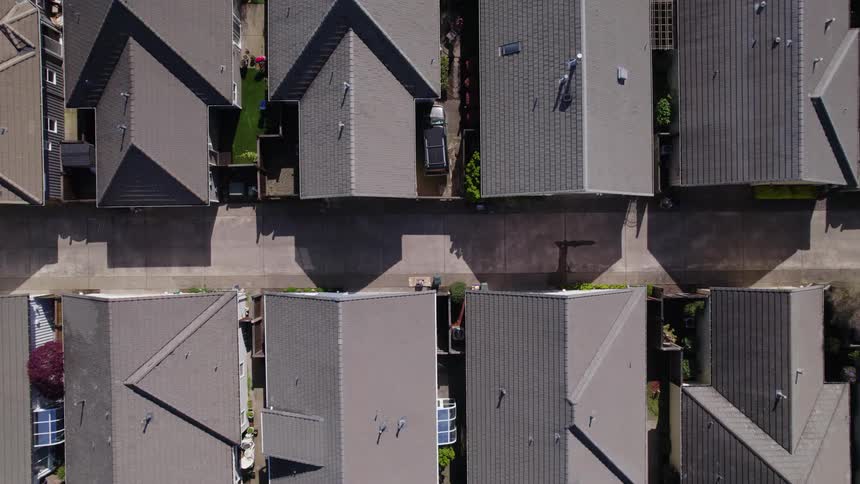 An aerial view of a residential neighborhood at midday
