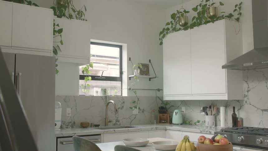 Interior design of a modern kitchen with fruits on the countertop