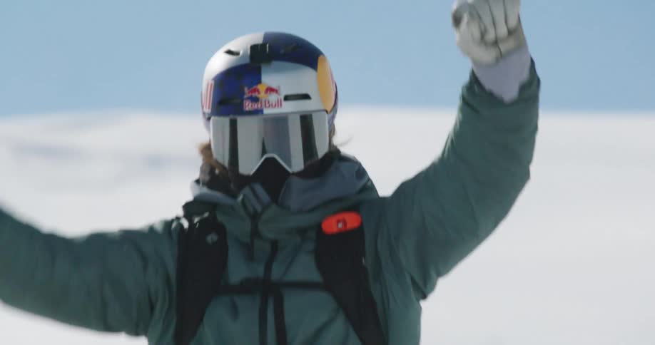 Person riding a snowmobile on thick snow terrain