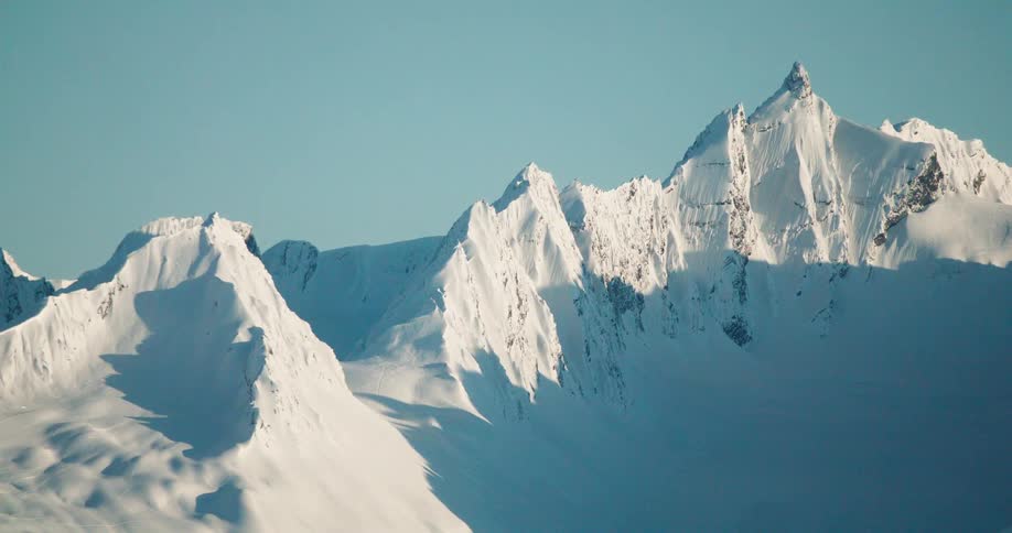 Sun is shining on the white mountains