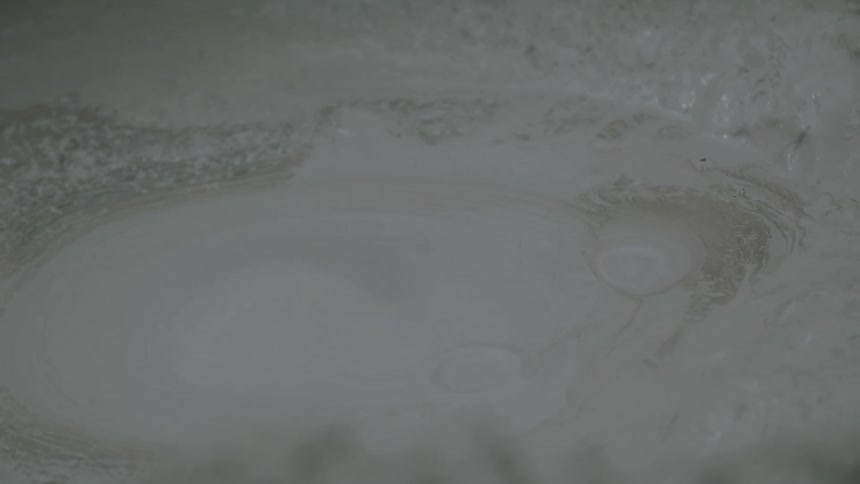 Bubbles forming in a bubbling mud pool