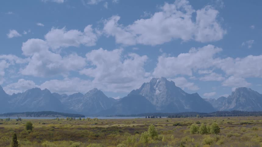 Green fields lead to the mountains