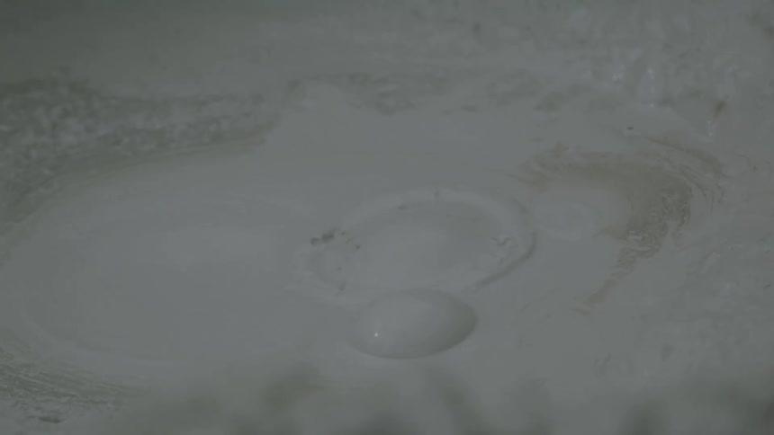 Bubble forms and bursts on the thick surface of bubbling mud