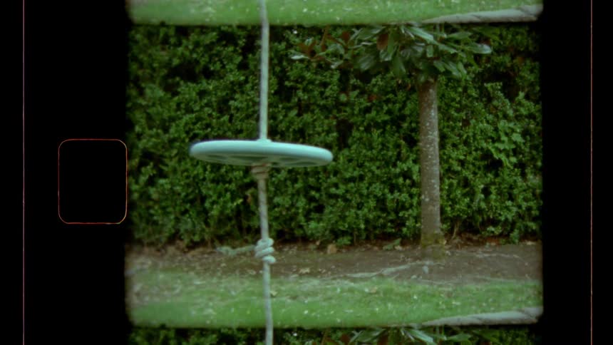 The swing sways back and forth in the yard