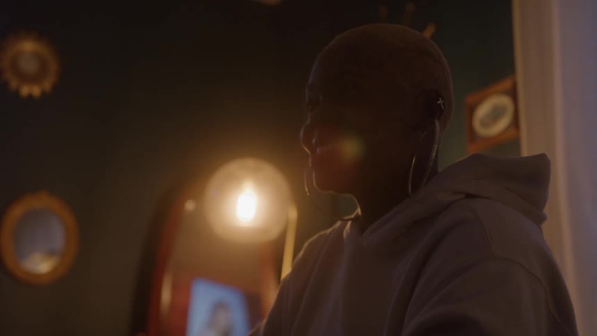 Two people play a dice game happily in a cozy living room