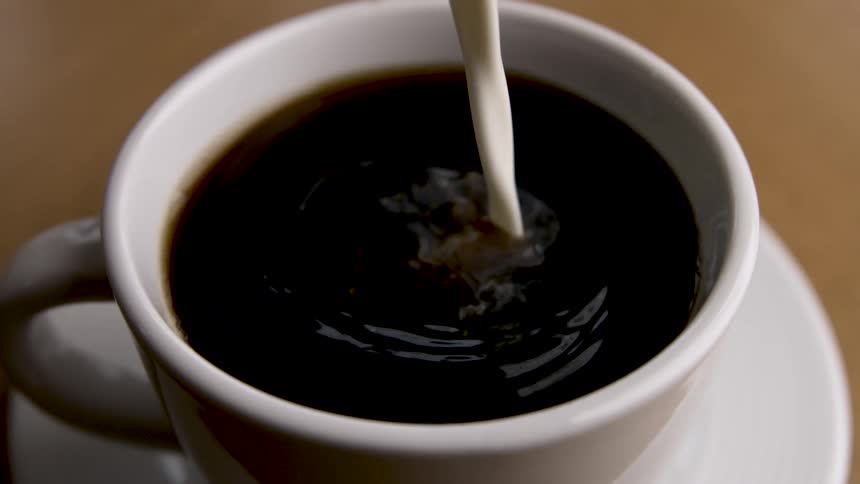 Coffee beverage lightens as a dairy product is added