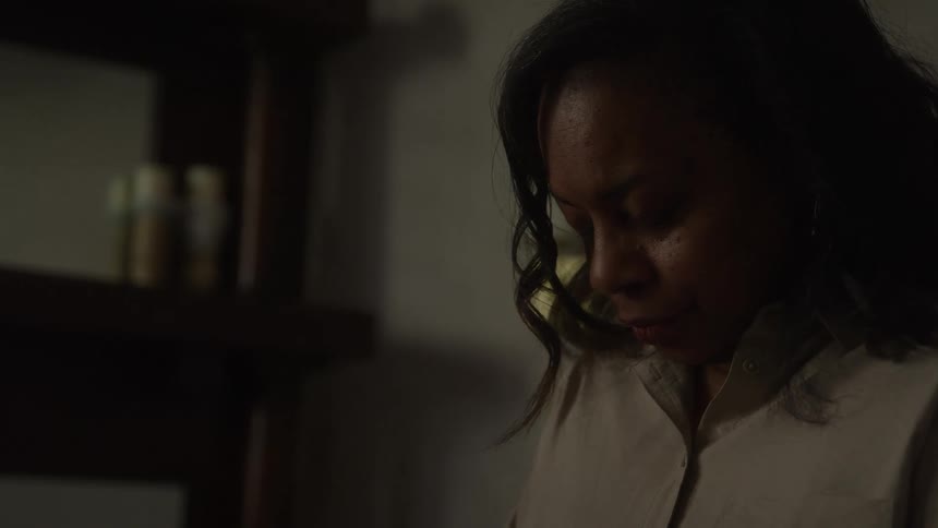A depressed woman sits alone feeling sad and lonely in bedroom