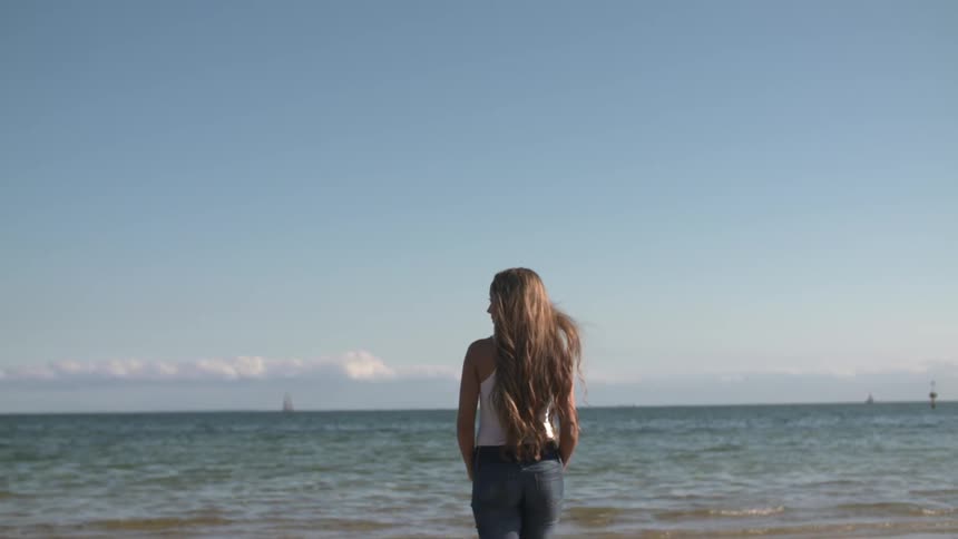 Woman standing near the shore
