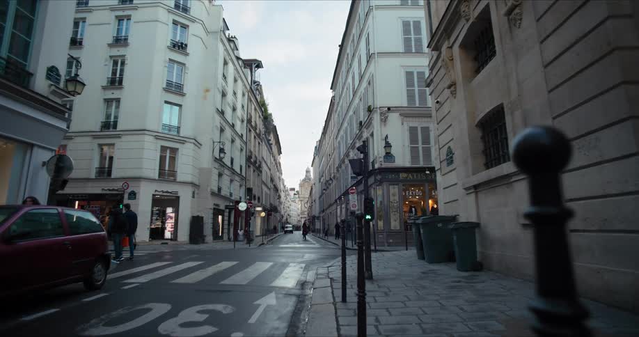 A busy street with multiple pedestrians in a metropolitan city during daytime