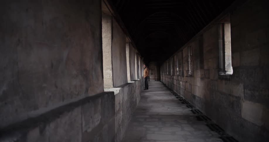 The man looks out the window of the fortress