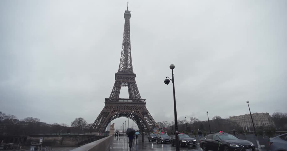 The eiffel tower outdoors in paris on a rainy day
